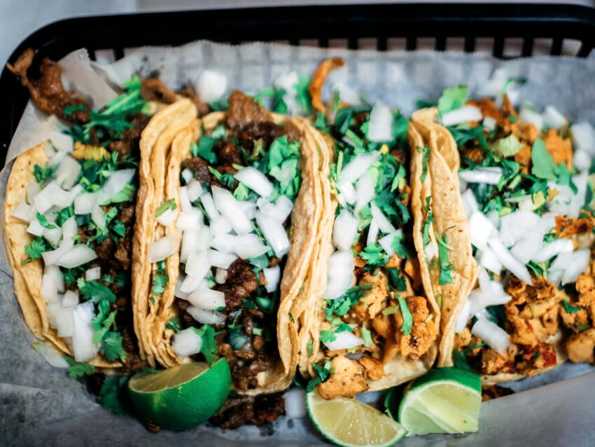 Four tacos side by side, small plates from Madre