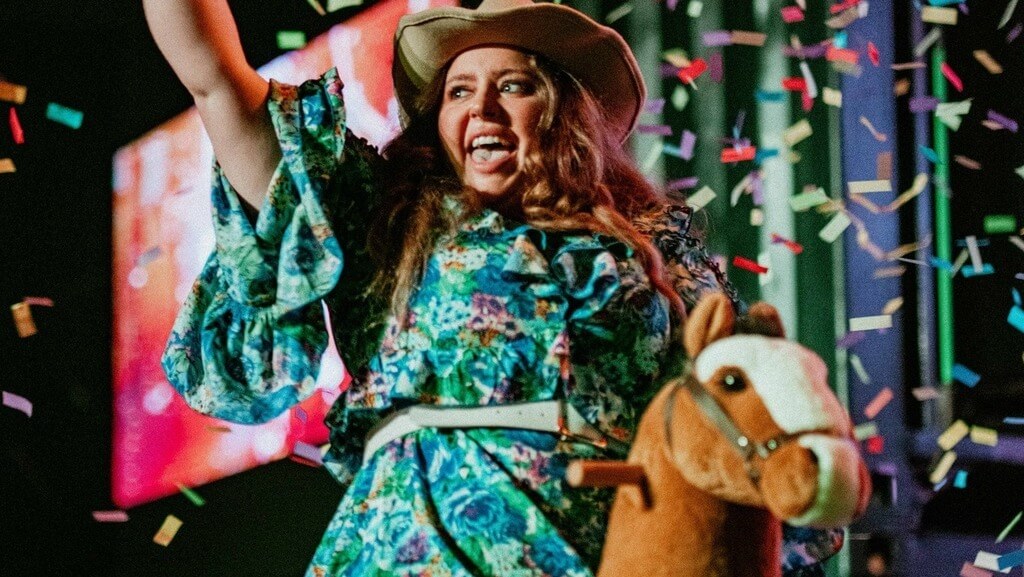 Woman celebrating at Bongo's Bingo, a fun and unique Liverpool hen do idea.